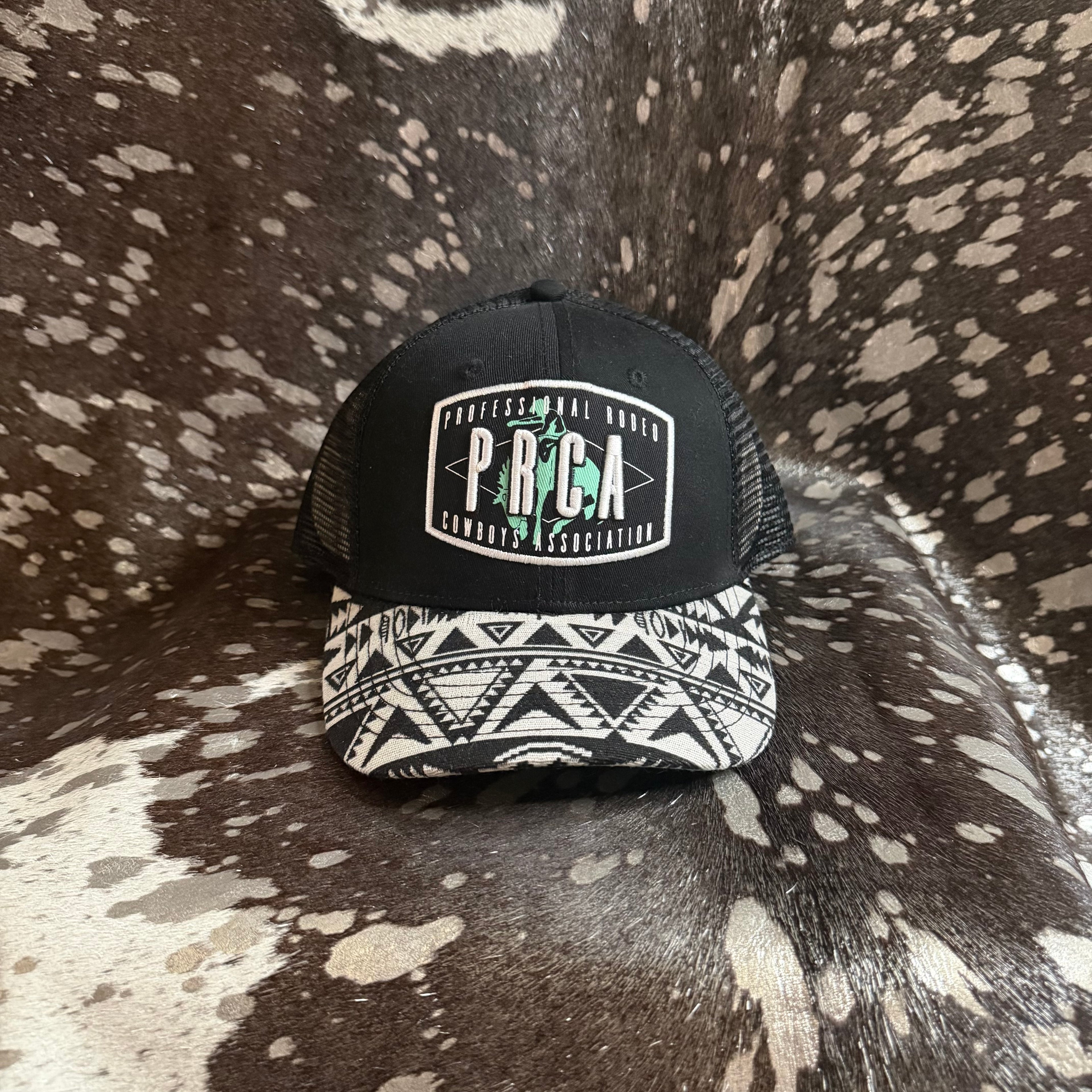 Black PRCA trucker style hat with Aztec trim